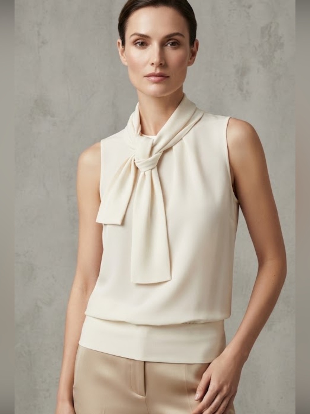 Vintage Express cream sleeveless blouse